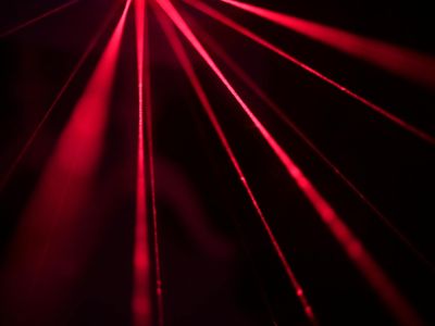 Subtle light effects on a dark background showing dynamic energy.